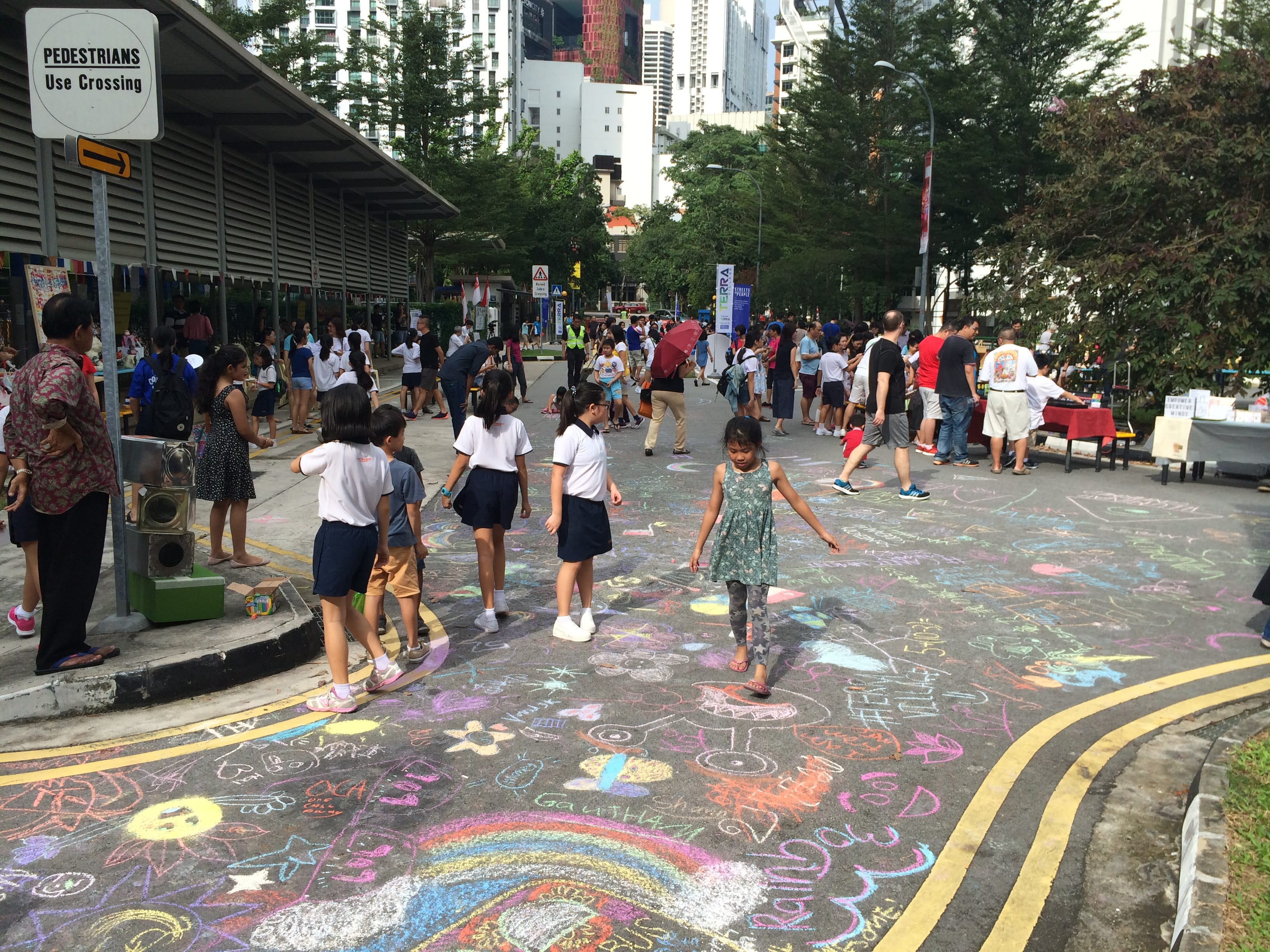 Photo of vibrant activities at road closure at Streets for People